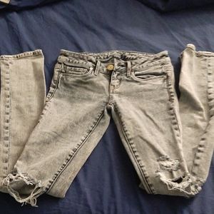 Light blue-gray ripped jeans